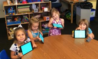 Photo by KidsU Preschoolers at KidsU at at University of Houston-Clear Lake with their iPads.