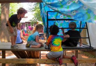 Photo by Lesley Romanoff, Takoma Park Cooperative Nursery School Children negotiate their loose parts structure.